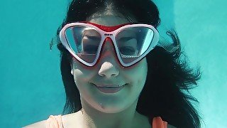 Sexy one piece swimsuit on a girl working out underwater