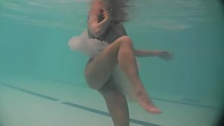 Sheer white dress on a teen swimming in the pool