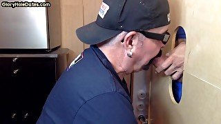 Mature DILF deepthroats and slurps on gloryhole dong