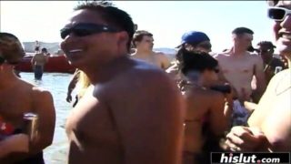 Horny girls taking off their tops on the beach