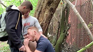 Two Brit guys have sex in woods. Third guy joins in