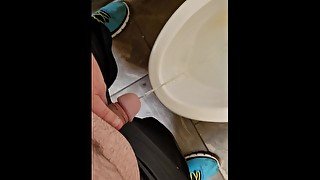 Chubby boy pissing in a public bathroom