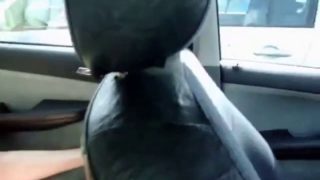 Erect boobed girl masturbates inside car