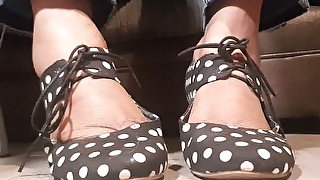 Polka dot shoes and very dirty feet