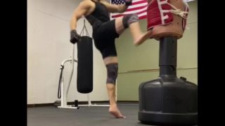 Mucsle stud kickboxer with perfect feet