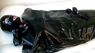 Girl Punished In Rubber Sleepsack