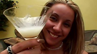 Lusty blonde is drinking fresh cum from a martini glass, after sucking dicks and getting fucked