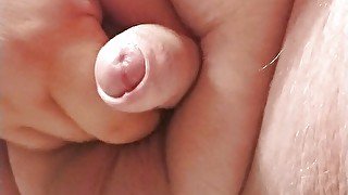 Close up of tiny cock jerking off