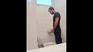 camera in the bathroom of a well-known company, man pisses with his Italian cock