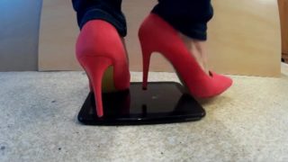 Crushing a Tablet with red heels