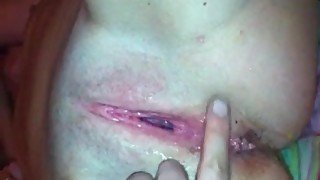 He fingers her pussy as his cumshot drips out