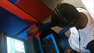 spy guy cum in his hand in cyber cafe