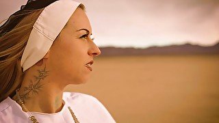 Slutty nun Ivizia Dakini shows off her gorgeous body in the desert