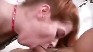 Redhead Oils Up A Big Dick For A Handjob