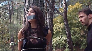 Russian Woman Tape Gagged And Tied To A Tree