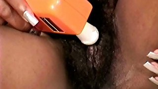 Nasty ebony wife of mine pokes her hairy cooch with vibrator