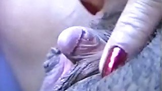 Rubbing and tickling her swollen big clit on camera