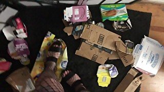 Busty BBW babe in platforms crushes cans, boxes and garbage