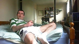 Wanking in footie top and spunking over my shorts