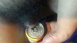 Pissing on a Thai tea soda can