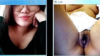 Asian woman watches girl masturbate on webcam