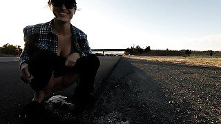 Pissing on the side of a busy road