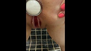 Pissing on her filled asshole