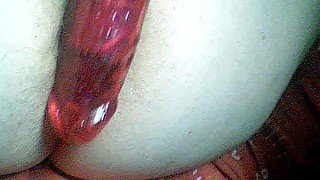 Teasing myself in the anus with my big glass dildo