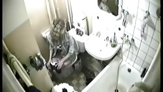 Blonde was caught in the intimate moment of peeing on toilet