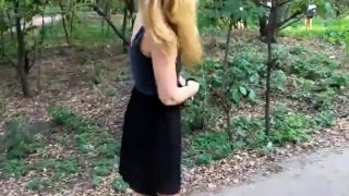 Girl walks in the Park with naked booty