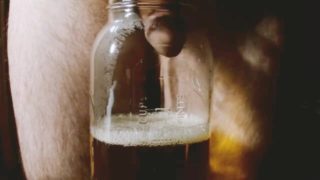 Straight hairy guy fills mason jar with quart of piss