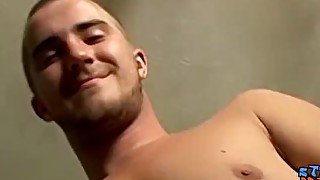 Straight thug tugs on his cock and cums all over his belly