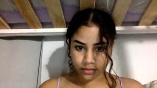 Latin teen smokes cigarette in lingerie