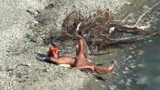 Couple fucking on a public beach, while walking past people