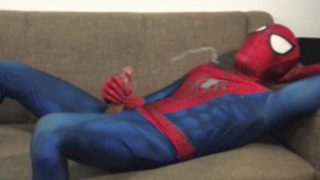 Horny Spiderman jerks off and cums massive load