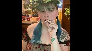 Smoking in pig tails with a flower crown