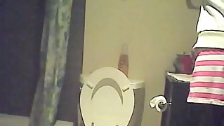 Hidden piss cam in the home toilet shows peeing sister