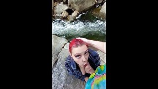 Amateur milf gives nature blow job on waterfall