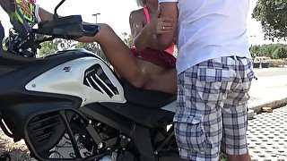 Blonde masturbates and pisses on a motorcycle.