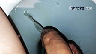 Pissing in a dirty public toilet