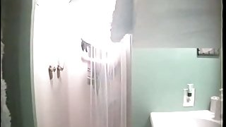 Sexy sporty girl gets caught in a shower by a hidden cam