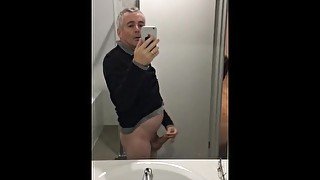 Stroking my erect penis until I climax and ejaculate