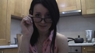 Splendid teen with glasses chatting in the kitchen