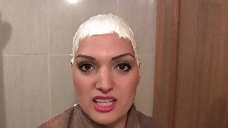 Cute girl headshave with cream and razor