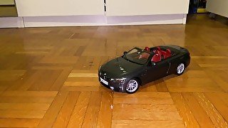 Playing with a BMW M4 cabrio toy car