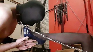 The slave sniffs and kisses the armpits and boobs of the Dominatrix. Mistress takes off her bra