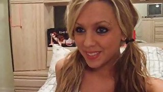 Cute bright blondie with pigtails undresses and flashes her shaved pussy