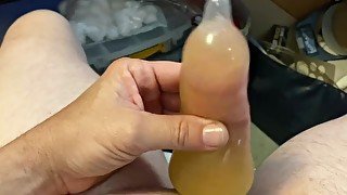 Stroking in pee filled condom