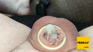 Pulling off condom from small spent dick