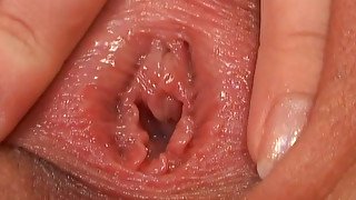 Naughty blonde finger fucks her pussy and gapes it for a wide screen